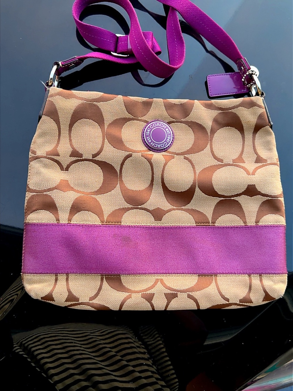 “Coach Brown Signature Canvas Crossbody with Purple Trim”